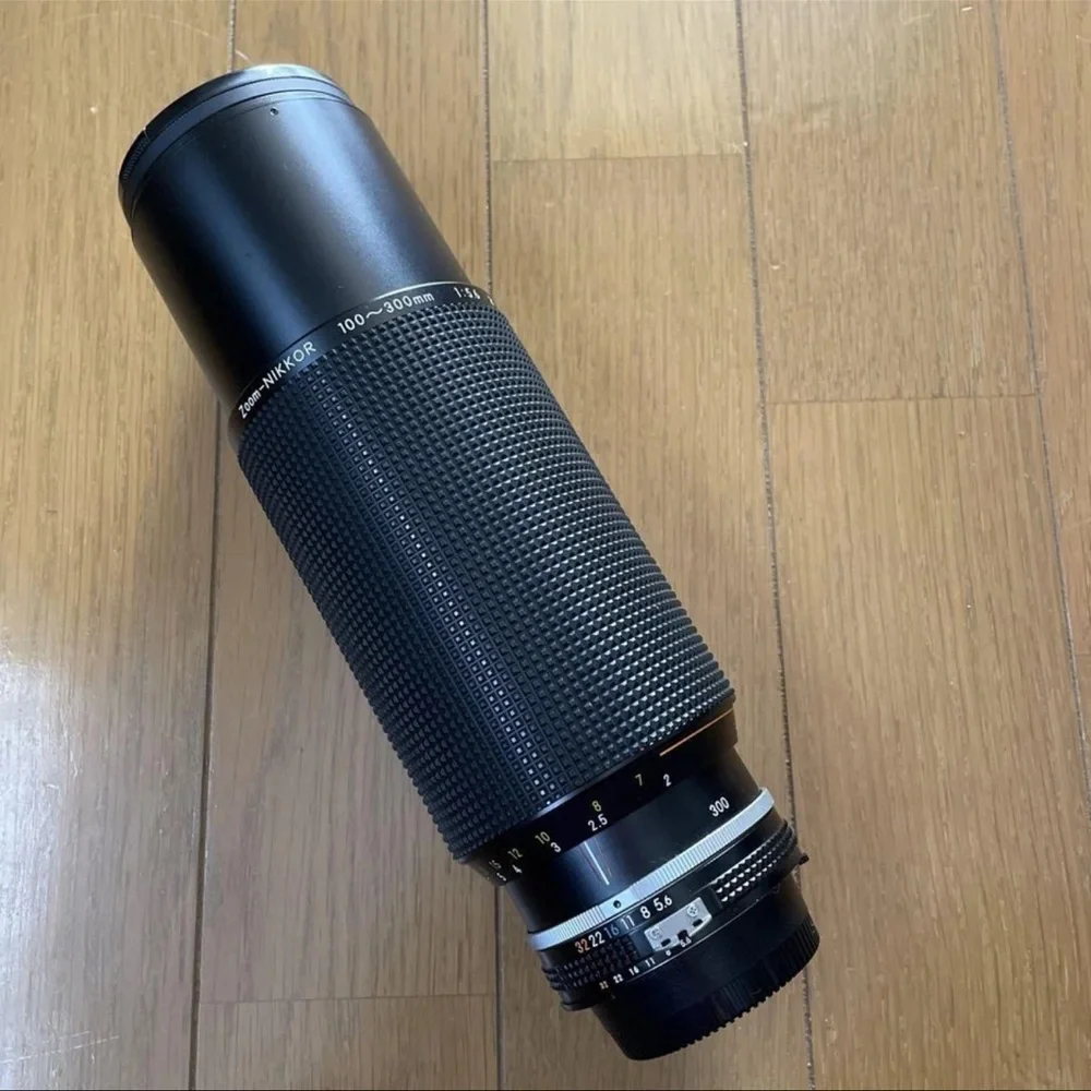 Nikon Black 300mm Telephoto Lens camera and multiple lenses and other parts